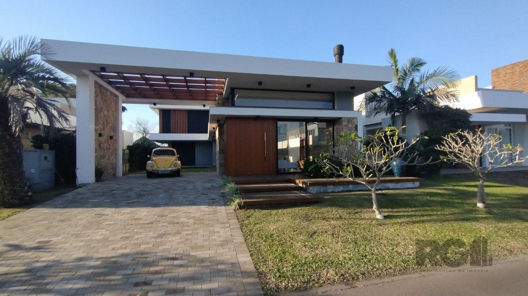 Casa Condominio com 240m², 4 dormitórios, 4 suítes, 3 vagas no bairro Condomínio Villagio Atlântida em Xangri-Lá para Comprar