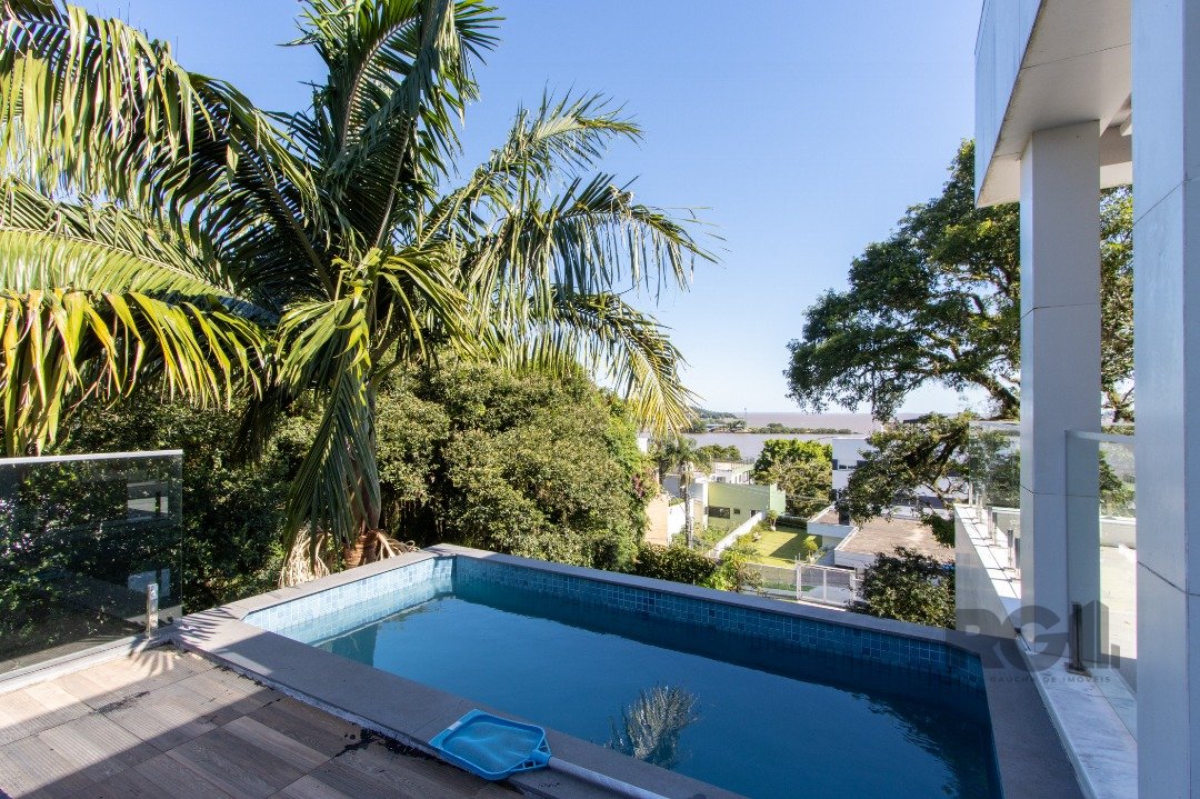 Casa com 430m², 2 dormitórios, 2 suítes, 5 vagas no bairro Vila Assunção em Porto Alegre para Comprar