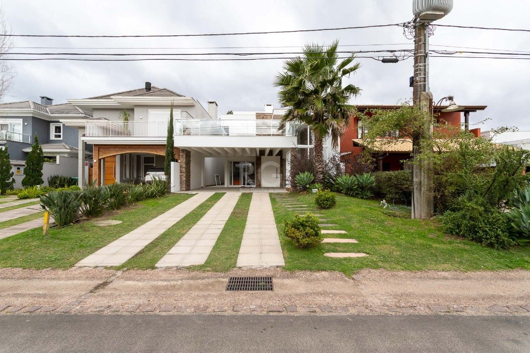 Casa Condominio com 294m², 5 dormitórios, 5 suítes, 4 vagas no bairro Terra Ville em Porto Alegre para Comprar