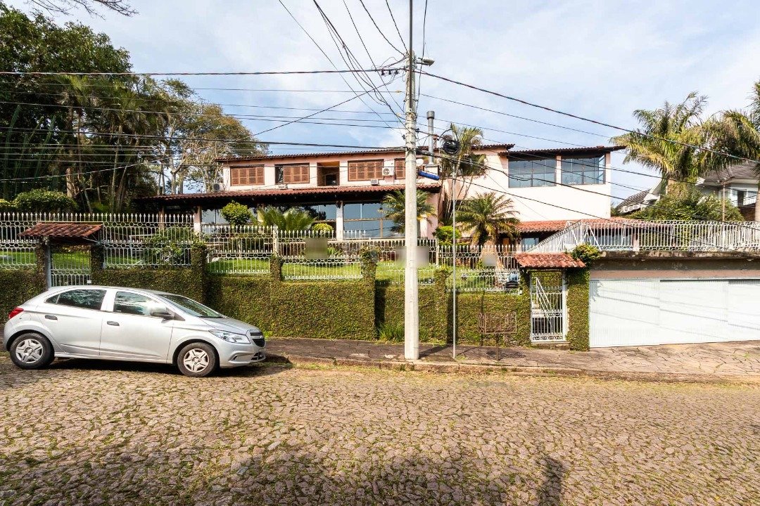 Casa com 500m², 4 dormitórios, 1 suíte, 4 vagas no bairro Vila Conceição em Porto Alegre para Comprar